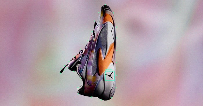 Side view of Luka Doncic's purple and orange Jordan Brand shoes.